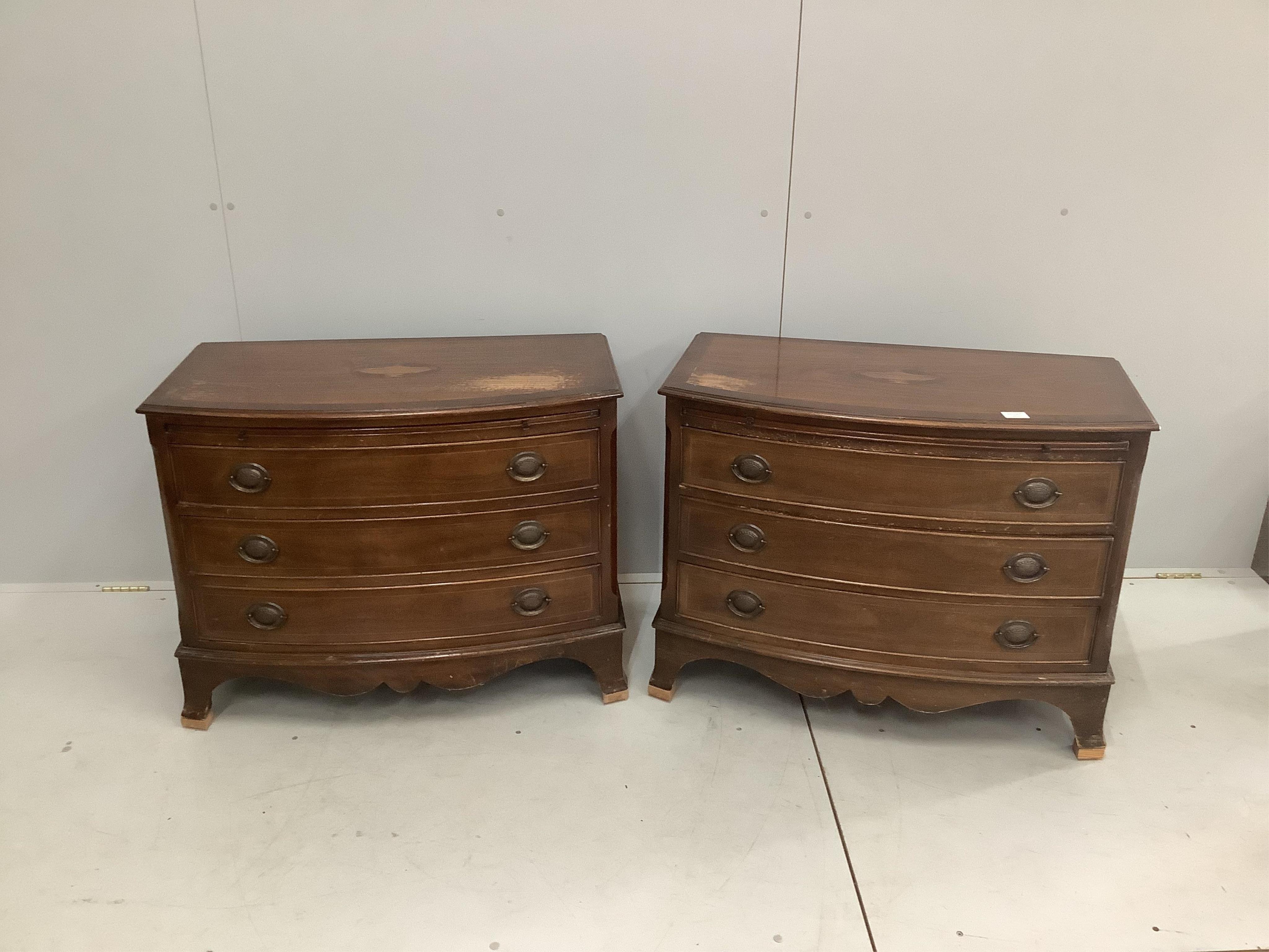 A pair of reproduction inlaid mahogany bow front chests of three long drawers, width 87cm, depth 49cm, height 68cm. Condition - poor to fair